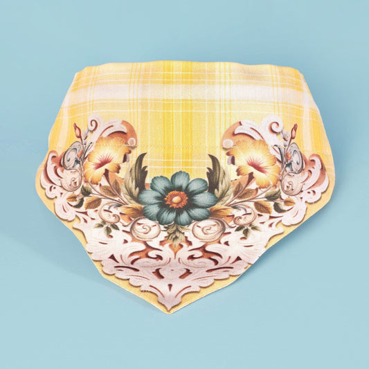 A yellow plaid cat and dog slide-on  bandana with a white and teal floral scroll design 