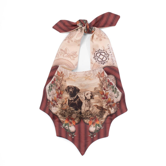 Beige dog bandana with two hunting dogs in a fall leaf decorative motif and a burnt orange striped pattern