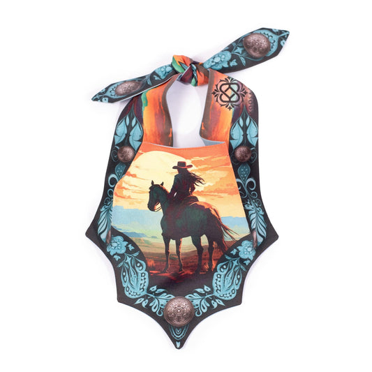 Dog bandana with a cowgirl riding horse into the sunset and a black and turquoise western pattern design 