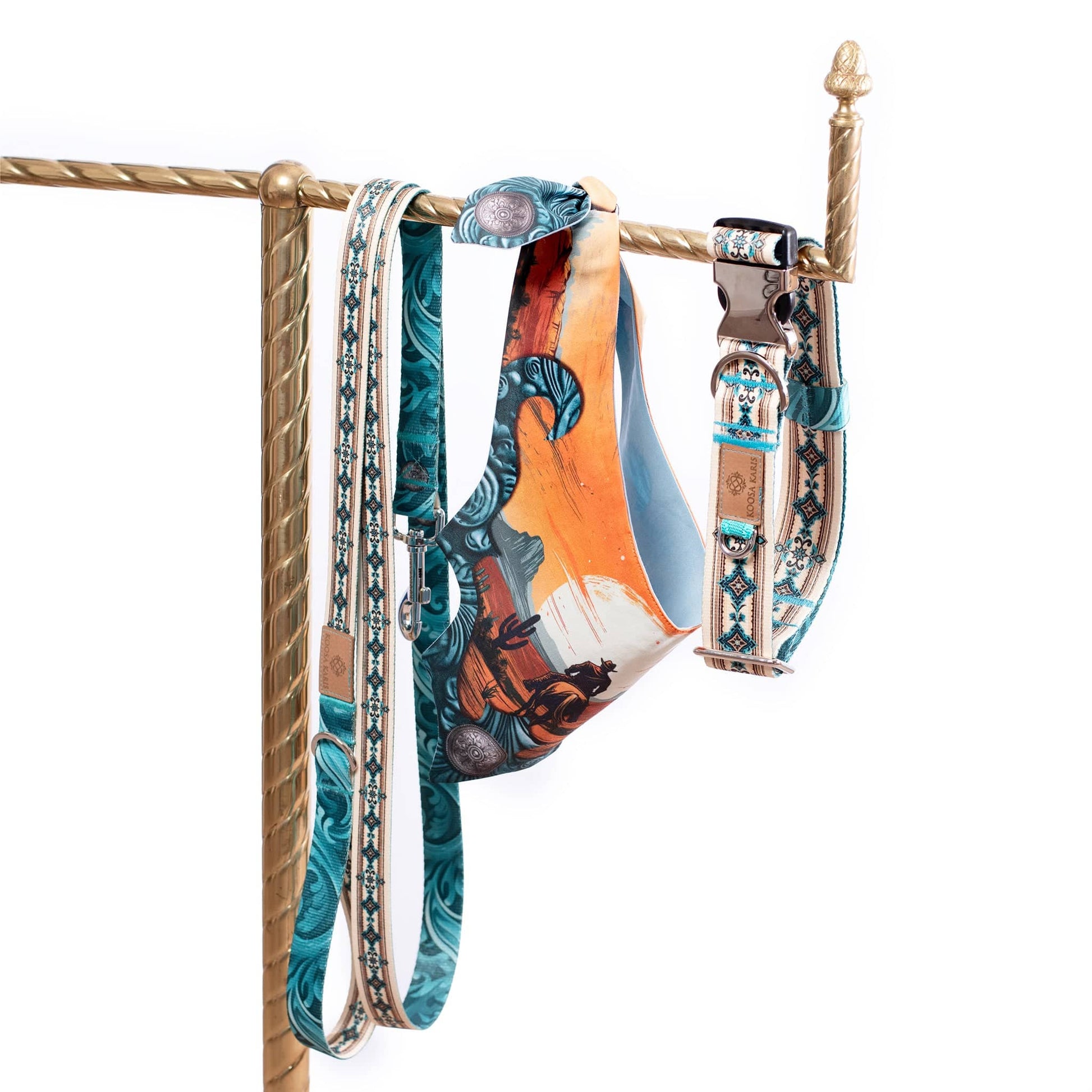 Dog collar and leash set with silver-toned metal hardware and a turquoise western diamond  print there’s also a coordinating dog bandana that features a cowboy on horseback riding into the sunset