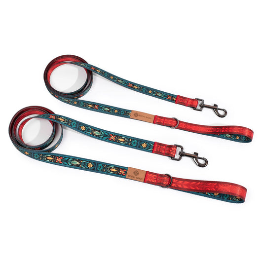 Cobalt blue and red dog leashes with a colorful southwestern floral pattern and gunmetal-toned hardware