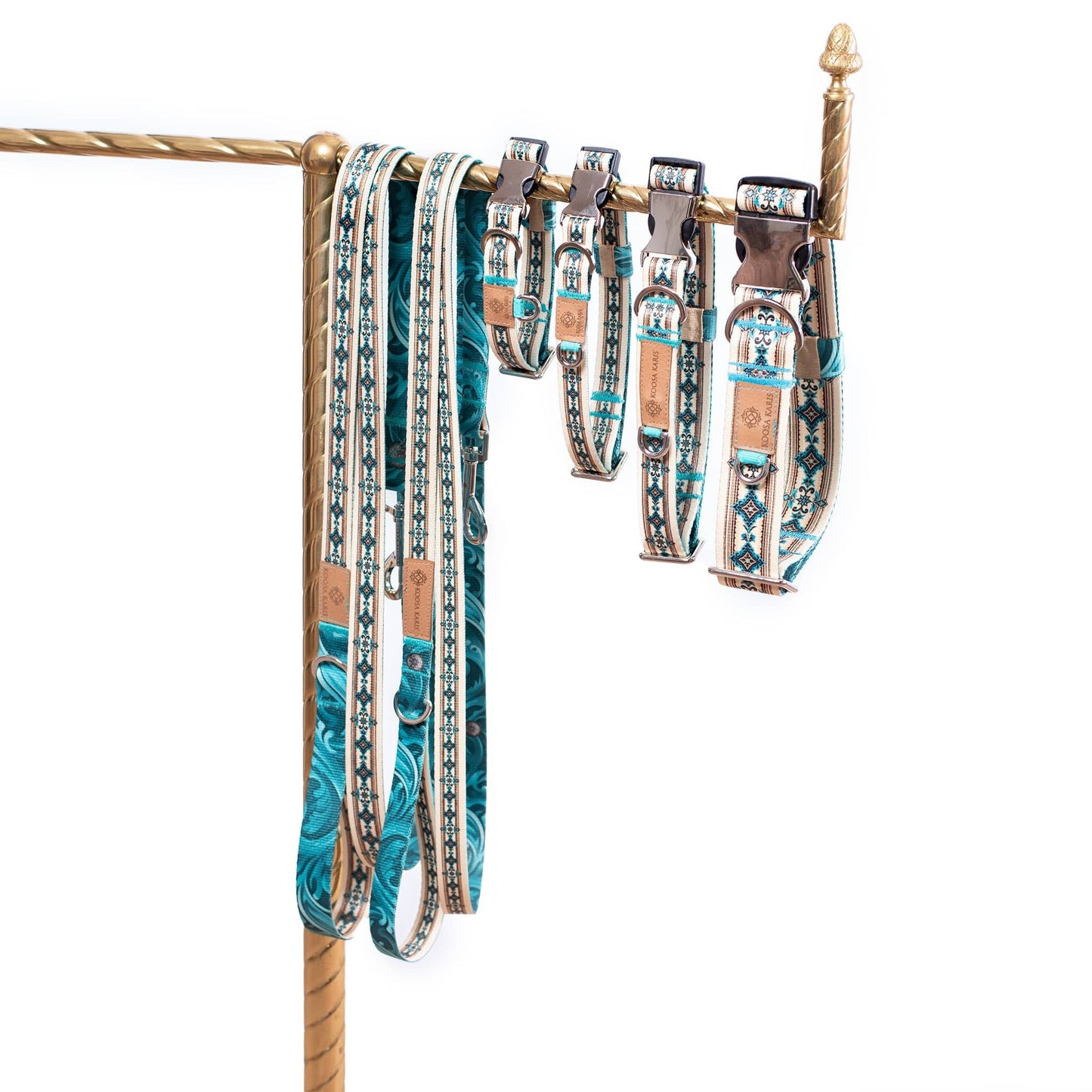 Dog collars and leashes with a western turquoise diamond pattern and silver-toned metal hardware 